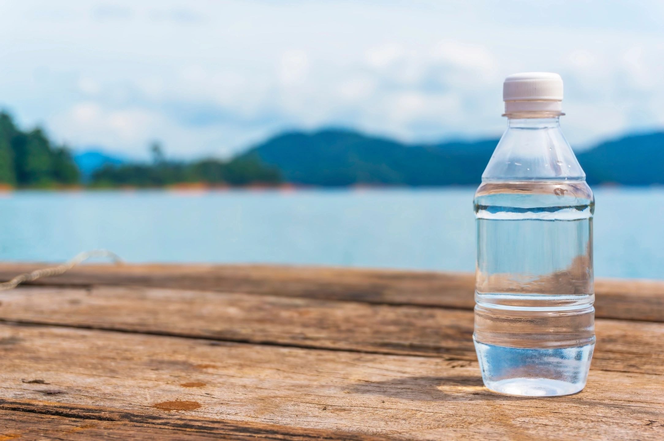 Water bottle on beach in nature